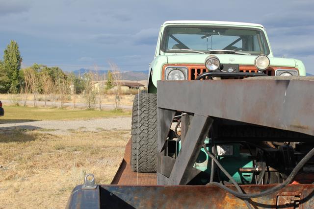 On the trailer behind the truck
