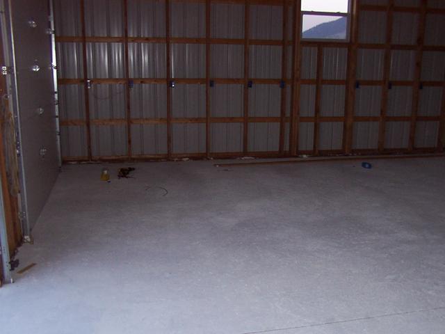 View of the "work bay" area, painted floor has cured, electrical boxes installed