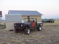 Devil off the trailer, parked by the shed