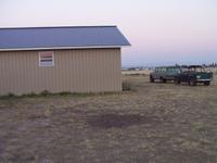 Another view of the parking area, plus the rigs parked off the end of the garage