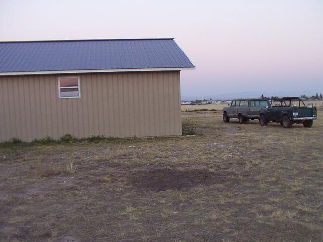 Another view of the parking area, plus the rigs parked off the end of the garage