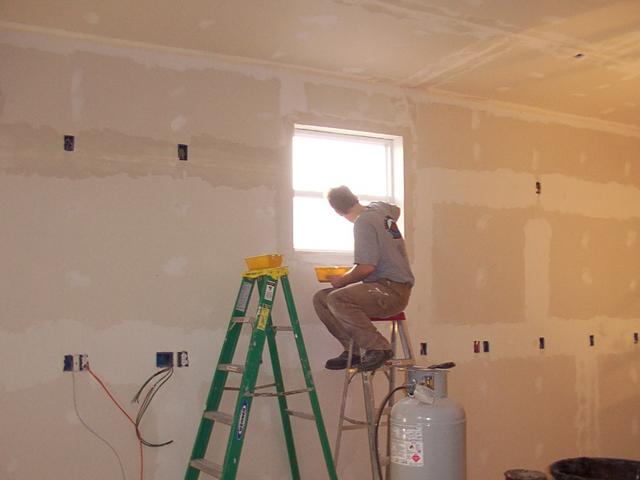 3/21 - Tom is putting in the corner bead for the window