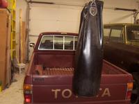 Michelle's heavy bag clears the tailgate by a couple of inches.