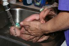 Joleigh's first bath in Gram's sink