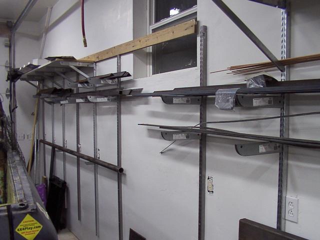 Steel storage system - slotted track and shelf brackets from Home Depot