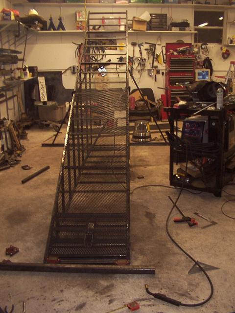 10/8 - mid-diagonal in place, rear supports in place, first section of expanded steel welded down the right side only.