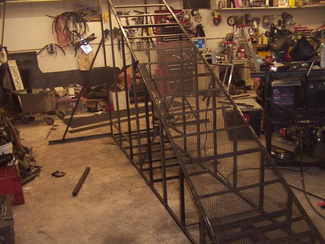 10/8 - mid-diagonal in place, rear supports in place, first section of expanded steel welded down the right side only.