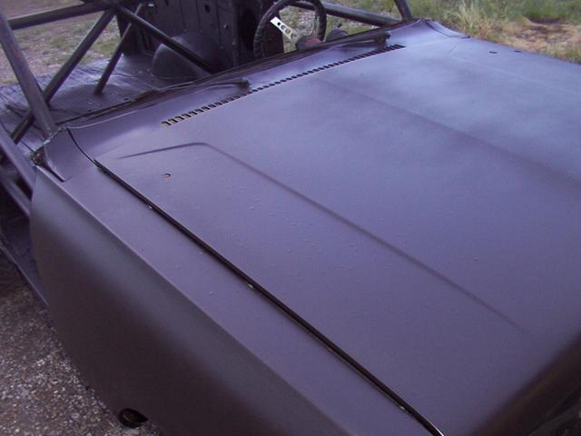 05/14/05 After four coats of Zero Rust black, no clear yet - if you can see the big globs on the passenger side of the hood, tha