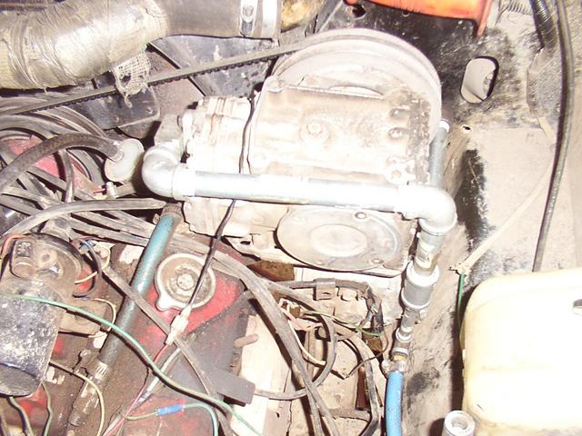 As installed in the Scout.  Short blue hose comes straight towards the firewall to the gauge, pressure switch, safety valve.