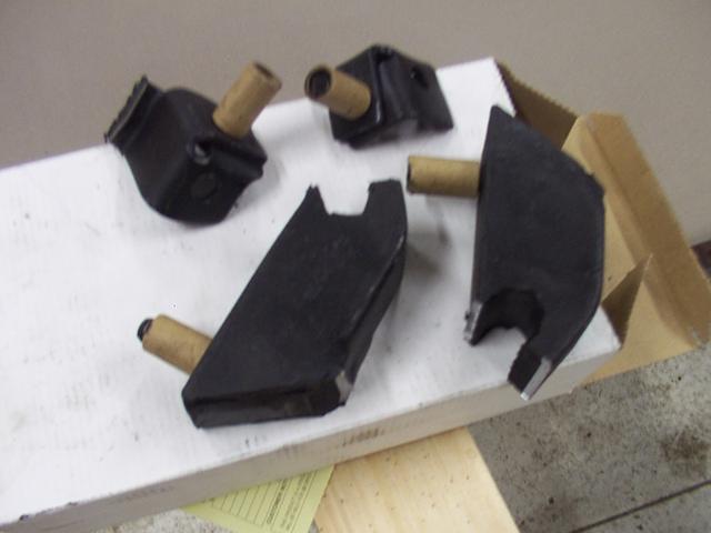 The two large pieces toward the bottom are the new bump-stops I've built after cutting the "ears" off, making a "