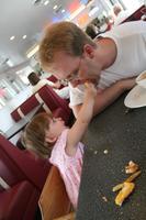 Lunch at the Moab Diner - Joleigh feeds Dad some of her left over grilled cheese