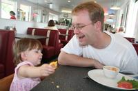 Lunch at the Moab Diner - Joleigh feeds Dad some of her left over grilled cheese