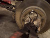 Remove the snap-ring on the end of the axle shaft