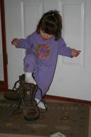 Febuary 13, 2008 - Trying on Dad's boots, and eating a cupcake face-first