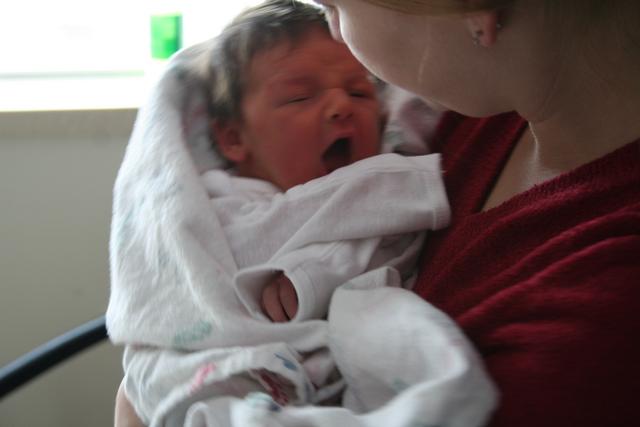 IMG_7128 - Audrey in Paige's arms - open mouth