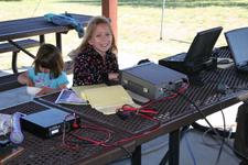 Carrie Mandera (10) making 20M SSB contacts at the GOTA station