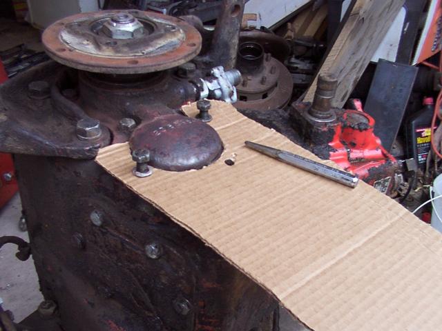 Making my cardboard template for the tailhousing transmission mount bracket using cardboard.