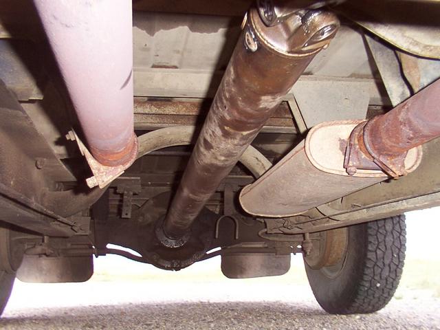 Looking to the rear, starting at approximately the carrier bearing crossmember.  Passenger muffler cut off and mid-replacement