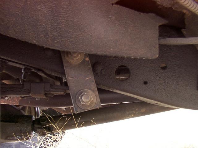 1972 1110 Travelall spring hanger, with shackle mount just behind it (where the strut-rod is on the coil trucks).  Right is to t