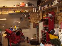 View of the work-corner.  Engine and cart on the left, then a filing cabinet, rollaway toolbox, parts washer as you go to the ri