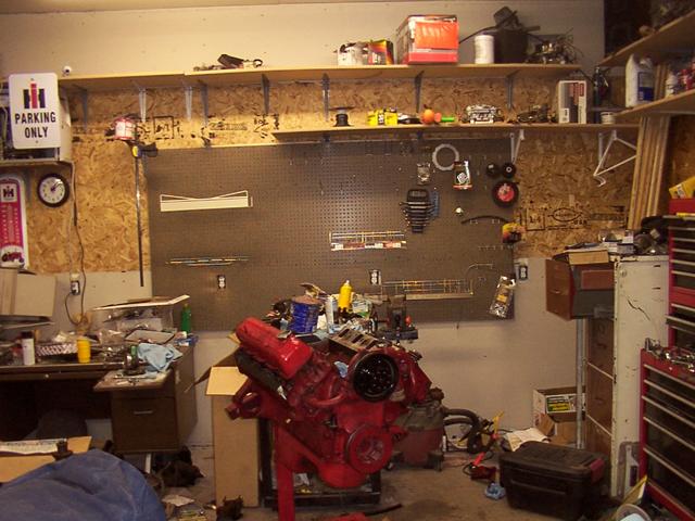 View of the work-corner. Desk,  Engine and cart on the left, then a filing cabinet, rollaway toolbox as you go to the right.  