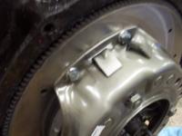 Retaining tab that goes away after you bolt it down.